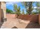 The fenced backyard features a low maintenance rock garden, providing a private space at 28 Yellow Flame Ave, North Las Vegas, NV 89084