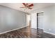 Bedroom with ceiling fan, closet, and plank flooring at 28 Yellow Flame Ave, North Las Vegas, NV 89084