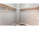 Walk-in closet with shelving and wood-look floors at 28 Yellow Flame Ave, North Las Vegas, NV 89084