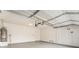 Spacious two-car garage with water heater and ample room for storage at 28 Yellow Flame Ave, North Las Vegas, NV 89084