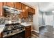 Kitchen with stainless gas oven and range with tile backsplash and bar-top counter at 28 Yellow Flame Ave, North Las Vegas, NV 89084