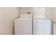 Laundry area with white washer and dryer machines at 28 Yellow Flame Ave, North Las Vegas, NV 89084