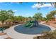 A well maintained community playground with benches, slides, and landscaped areas at 28 Yellow Flame Ave, North Las Vegas, NV 89084