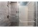 Modern tiled shower with glass door and rainfall shower head at 28 Yellow Flame Ave, North Las Vegas, NV 89084