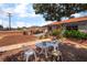 Inviting backyard featuring a quaint patio set, charming landscaping, and plenty of space for outdoor activities at 300 N 14Th St, Las Vegas, NV 89101