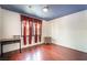 Comfortable bedroom offers wood floors, an accent painted ceiling, and a large window for natural light at 300 N 14Th St, Las Vegas, NV 89101