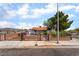 Cozy single-story home with a fenced yard and desert landscaping offering privacy and curb appeal at 300 N 14Th St, Las Vegas, NV 89101