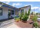 Charming home featuring a white brick exterior, blue trim, and a quaint front porch with flower beds at 300 N 14Th St, Las Vegas, NV 89101