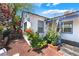 Stylish white-painted exterior with blue trim, rock-bed garden, and well-maintained landscaping at 300 N 14Th St, Las Vegas, NV 89101