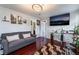 Bright living room featuring hardwood floors, modern lighting, and wall decor at 300 N 14Th St, Las Vegas, NV 89101