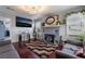 Relaxing living room with brick fireplace, flat screen TV, and comfortable couches at 300 N 14Th St, Las Vegas, NV 89101