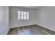 Bright bedroom with wood flooring, fresh paint and a large window at 3318 N Decatur Blvd # 2138, Las Vegas, NV 89130