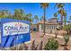 Inviting Coral Palms Condominiums with well-maintained landscaping and appealing architecture under a clear blue sky at 3318 N Decatur Blvd # 2138, Las Vegas, NV 89130