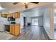 Bright, open-concept living room with fireplace, wood floors and sliding glass doors at 3318 N Decatur Blvd # 2138, Las Vegas, NV 89130