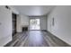 Living room featuring modern flooring, a decorative fireplace, and convenient access to other rooms at 3318 N Decatur Blvd # 2138, Las Vegas, NV 89130