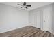 Bedroom with wood floors, a ceiling fan, closet with louvered doors and white door at 3550 Bay Sands Dr # 3006, Laughlin, NV 89029