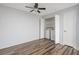 Bedroom with wood floors, a closet with washer and dryer, a ceiling fan, and white door at 3550 Bay Sands Dr # 3006, Laughlin, NV 89029