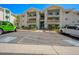 Condo building exterior featuring balconies, landscaping, and convenient parking at 3550 Bay Sands Dr # 3006, Laughlin, NV 89029