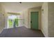 Condo entrance featuring a light green door with unit number, and view of trees from the hall at 3550 Bay Sands Dr # 3006, Laughlin, NV 89029