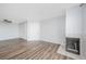 Open living room featuring wood floors, fireplace, closet, and a ceiling fan at 3550 Bay Sands Dr # 3006, Laughlin, NV 89029