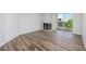 The living room with wood flooring, fireplace, door to the balcony, and white front door at 3550 Bay Sands Dr # 3006, Laughlin, NV 89029