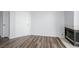 Open living room with wood flooring, fireplace, and white door at 3550 Bay Sands Dr # 3006, Laughlin, NV 89029
