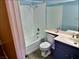 Bathroom featuring a shower-tub combination, white tiled walls, and a single sink vanity at 3729 La Junta Dr, Las Vegas, NV 89120