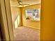 Bedroom featuring carpet flooring, and a large window providing ample natural light and views of the backyard at 3729 La Junta Dr, Las Vegas, NV 89120