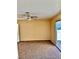 Bedroom with carpet, ceiling fan, and glass door to the backyard at 3729 La Junta Dr, Las Vegas, NV 89120