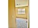 Bedroom with neutral carpet, window view of the tile roof and block wall at 3729 La Junta Dr, Las Vegas, NV 89120