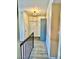 Upstairs hallway featuring a closet and modern light fixture at 3729 La Junta Dr, Las Vegas, NV 89120