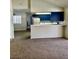 Living area adjacent to the kitchen with breakfast bar at 3729 La Junta Dr, Las Vegas, NV 89120