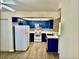 Updated kitchen with blue cabinets, tile backsplash, and stainless steel appliances at 3729 La Junta Dr, Las Vegas, NV 89120