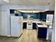 Well-equipped kitchen featuring dark blue cabinets and modern appliances at 3729 La Junta Dr, Las Vegas, NV 89120