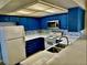 Bright kitchen with white appliances, custom cabinets, mosaic tile backsplash, and ample counter space at 3729 La Junta Dr, Las Vegas, NV 89120