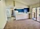 Bright living room featuring an open floor plan, breakfast bar, and sliding glass doors at 3729 La Junta Dr, Las Vegas, NV 89120