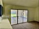 Bright living room with sliding glass doors leading to the backyard and an extended countertop at 3729 La Junta Dr, Las Vegas, NV 89120