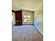 Spacious living room with brick fireplace and large windows overlooking the yard at 3729 La Junta Dr, Las Vegas, NV 89120