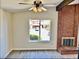 Living room featuring brick fireplace and large window views of the exterior at 3729 La Junta Dr, Las Vegas, NV 89120