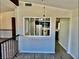 View of the upstairs loft area and kitchen through a decorative window at 3729 La Junta Dr, Las Vegas, NV 89120