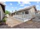 Cozy backyard featuring a raised deck area and access to both the house and side yard at 3936 Applecrest St, Las Vegas, NV 89108
