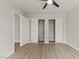 Bedroom featuring hardwood floors, a ceiling fan, closet and doorway at 3936 Applecrest St, Las Vegas, NV 89108