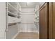 Walk-in closet with custom shelving and hardwood floors offers lots of space at 3936 Applecrest St, Las Vegas, NV 89108