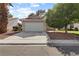 Charming single-story home with a well-manicured lawn and a two-car garage at 3936 Applecrest St, Las Vegas, NV 89108