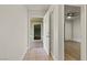 Hallway leading to walk-in closet and bedroom with hardwood floors at 3936 Applecrest St, Las Vegas, NV 89108