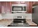 Modern stainless steel microwave and cooktop on the countertop in a kitchen setting at 3936 Applecrest St, Las Vegas, NV 89108