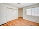 A bright room with wood flooring, closet, and window, providing a comfortable space at 420 Clifton Heights Dr, Las Vegas, NV 89145