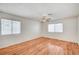 Bright bedroom with hardwood flooring, a ceiling fan, and a window overlooking the outdoors at 420 Clifton Heights Dr, Las Vegas, NV 89145