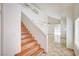 Bright entryway with wooden stairs, tile flooring, and views into the spacious living area with high ceilings at 420 Clifton Heights Dr, Las Vegas, NV 89145