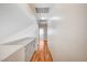 Hallway with wood floors and white walls leading to different parts of the home at 420 Clifton Heights Dr, Las Vegas, NV 89145